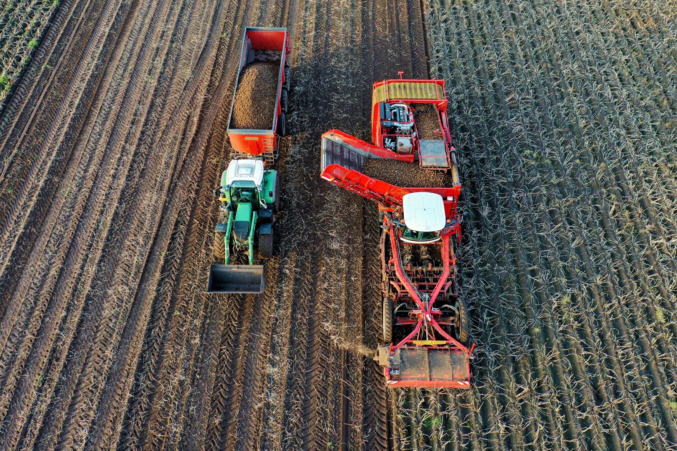 Image of farming equipment harvesting crops